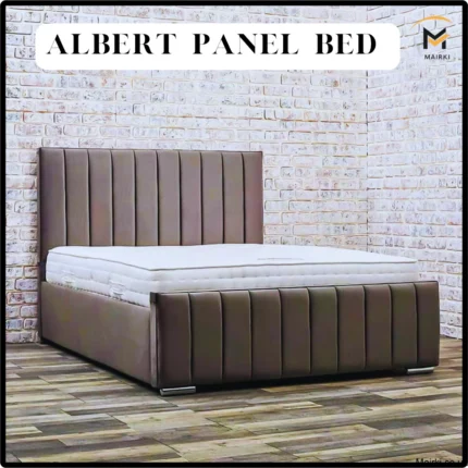 Albert Panel Bed with a tall, brown upholstered headboard and footboard against a brick wall.