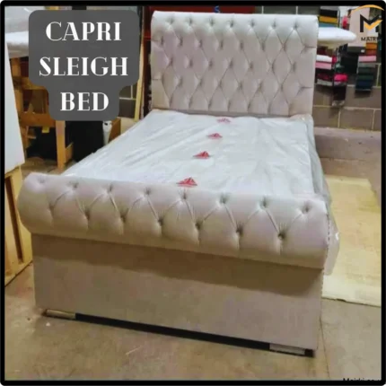 Luxurious Capri Sleigh Bed with tufted headboard.