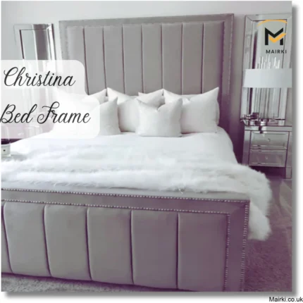 Luxurious bed with grey upholstered Christina Bed Frame and white decor.