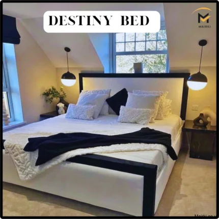 A modern bed called the "Destiny Bed" with a black frame and white upholstery, flanked by round pendant lights.