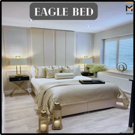 Modern bedroom with a central beige Eagle bed, decorative pillows, and nightstands with lamps.