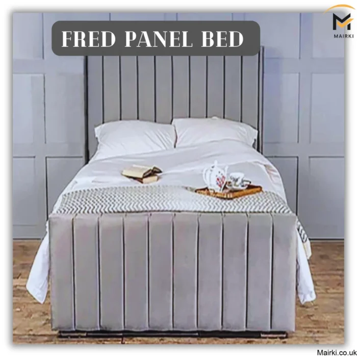 Fred Panel Bed with gray upholstery, white bedding, and decorative items.