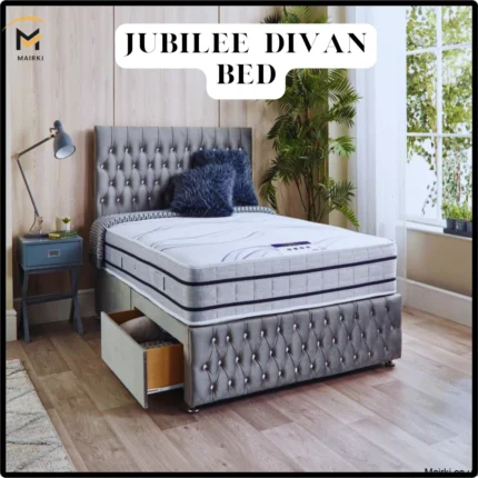 Jubilee Divan Bed with tufted gray headboard and storage drawer, modern bedroom setting.