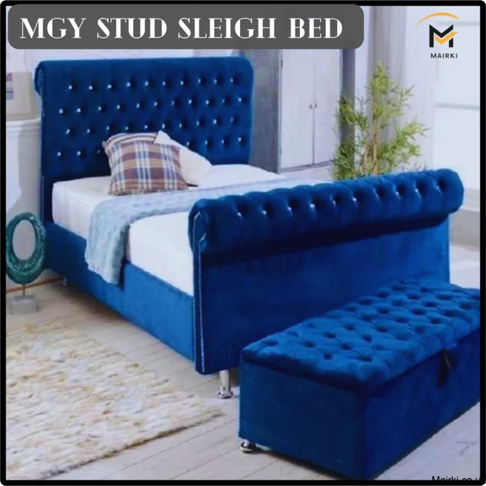 Blue velvet Mgy Stud Scroll Sleigh Bed sleigh bed with matching bench in a bedroom.