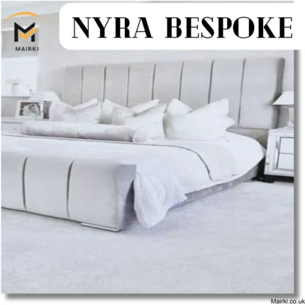 Modern, upscale bedroom with a large upholstered bed and text "NYRA BESPOKE."