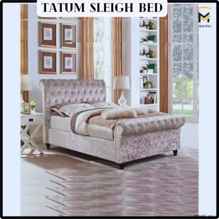 Luxurious bedroom with a Tatum Sleigh Bed, tufted headboard, and decorative elements.