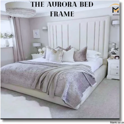 A modern bedroom featuring the Aurora bed frame with gray and white bedding.