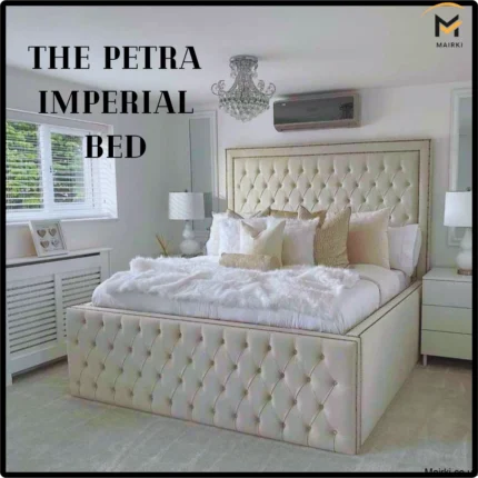 Luxurious bedroom featuring the Petra Imperial Bed, with a tufted cream headboard and matching footboard, surrounded by white decor.