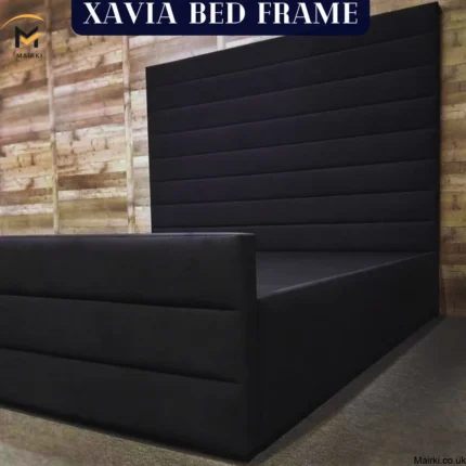 A modern dark bed frame with padded headboard and footboard.