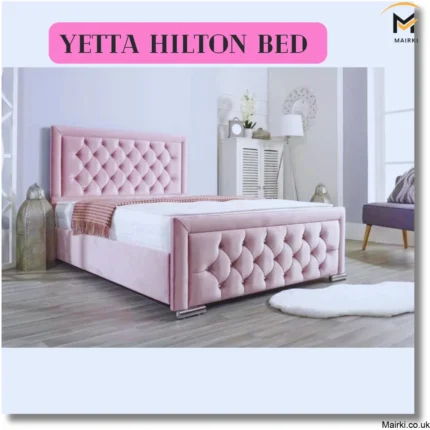 Pink tufted velvet bed in a modern bedroom with a tall vase and a floor lamp.