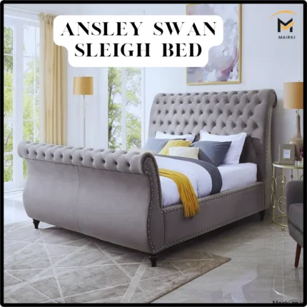 Light gray Ansley sleigh bed in a sunlit bedroom.