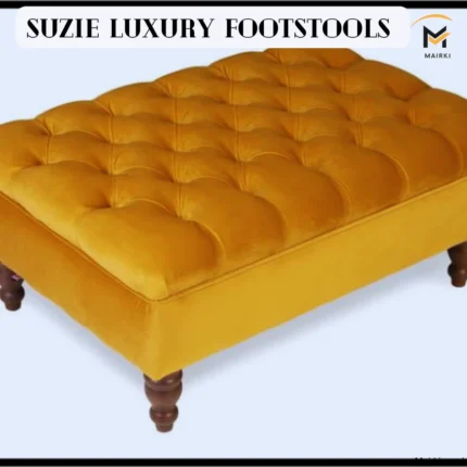 Mustard yellow tufted footstool with dark wooden legs.