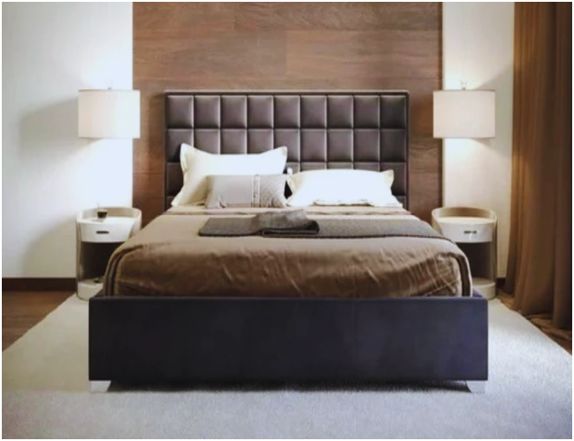 Super king size bed with a tufted leather headboard in a modern bedroom.