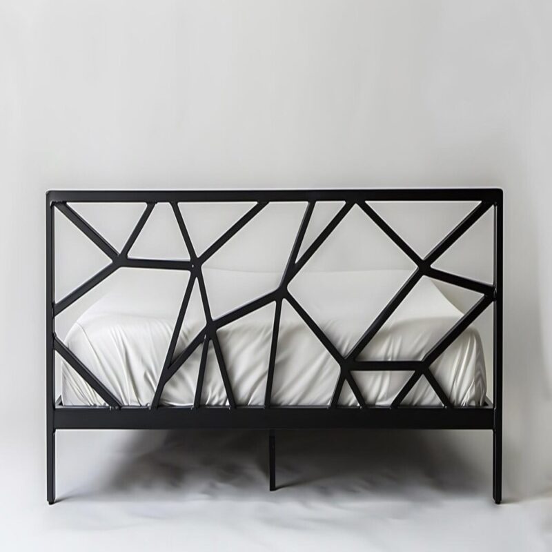 Black metal bed frame with geometric design.