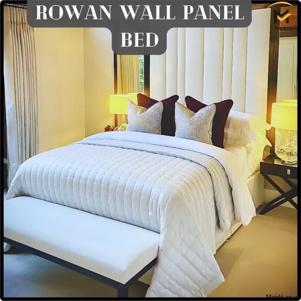 King size bed and mattress with a paneled headboard and quilted mattress in a well-lit bedroom.