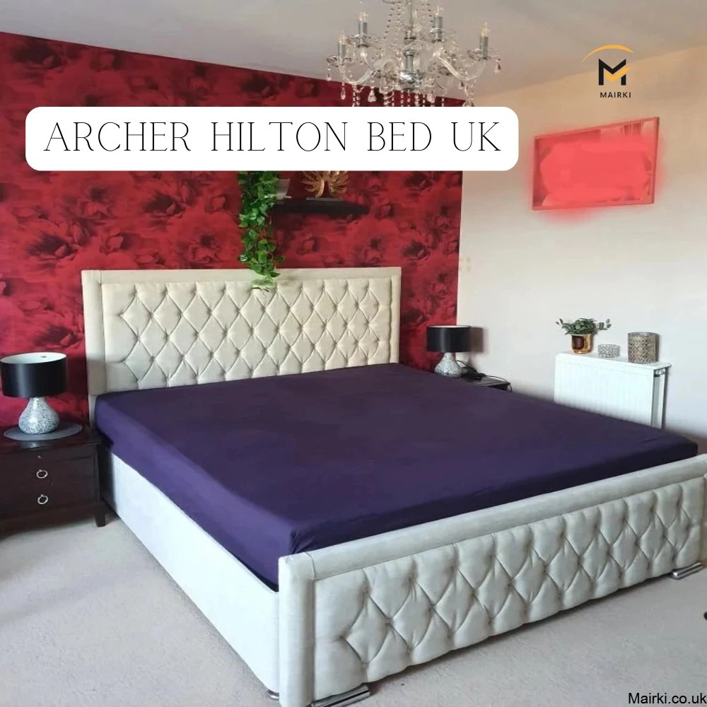 Bedroom with a Super King Size beige tufted bed frame, red floral wallpaper, and a chandelier.