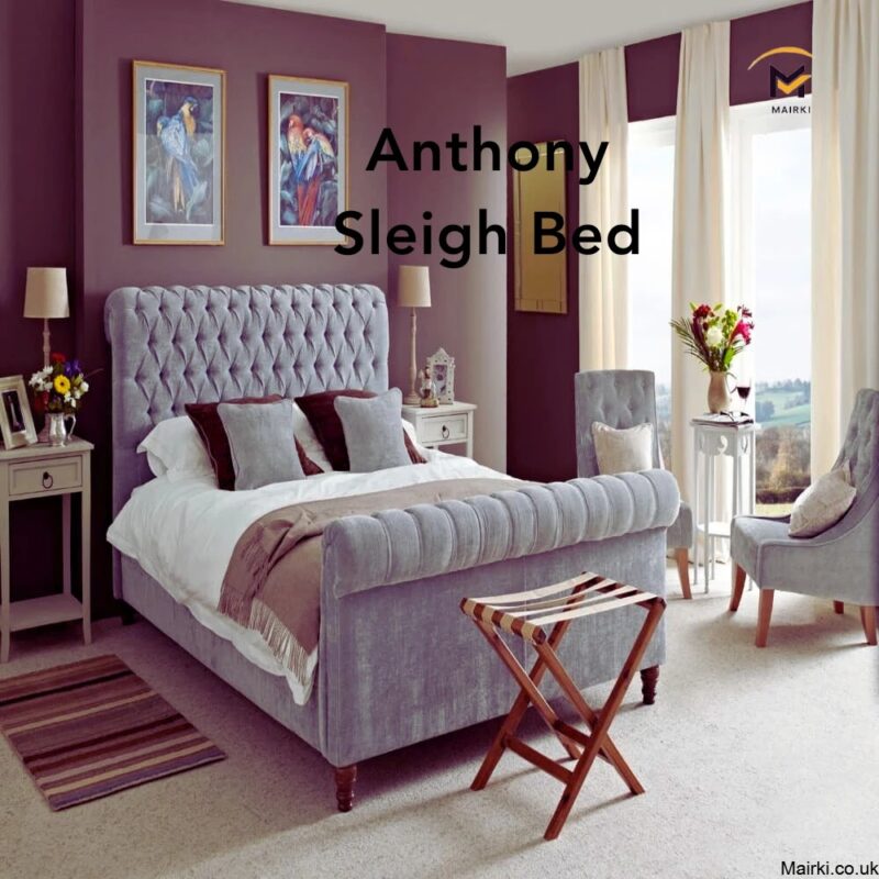 A bedroom with a gray wooden sleigh bed and purple walls.