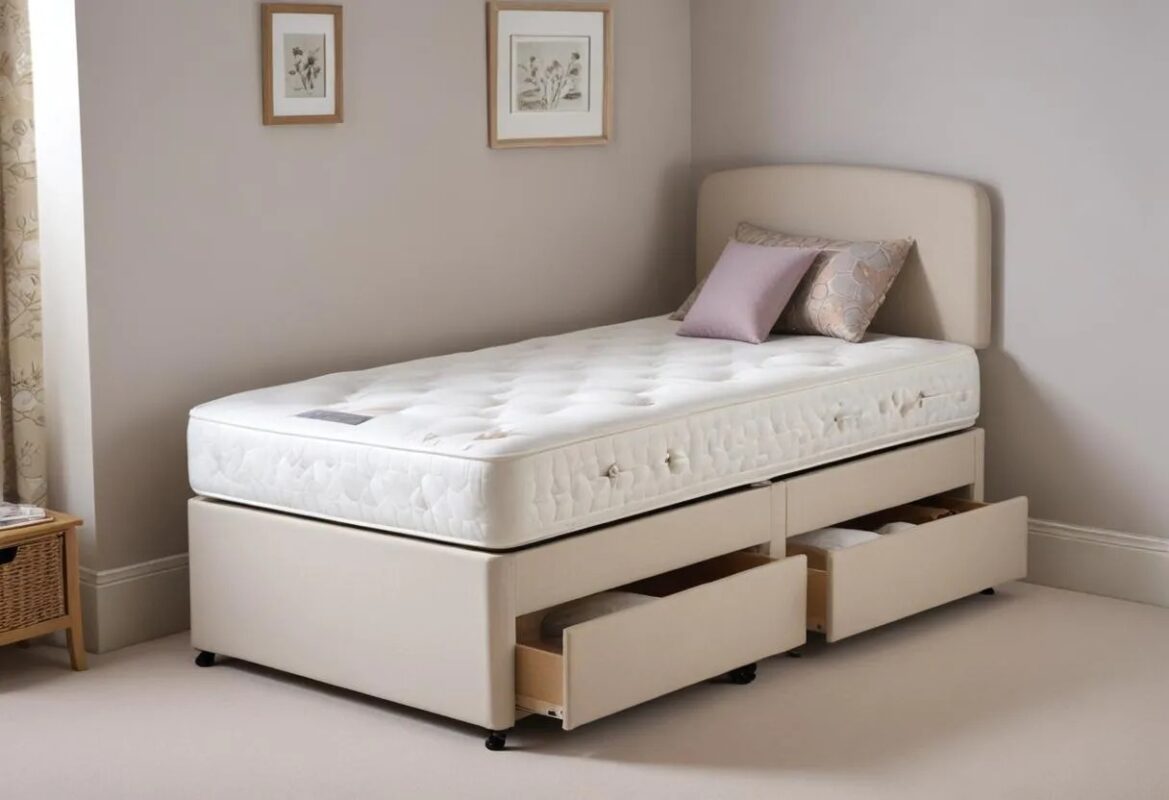 Wooden single bed with a cushioned headboard and storage drawers, in a bedroom with framed botanical art.