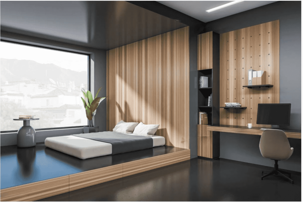 Modern room with a Murphy bed with desk setup, featuring wood paneling and warm accents.