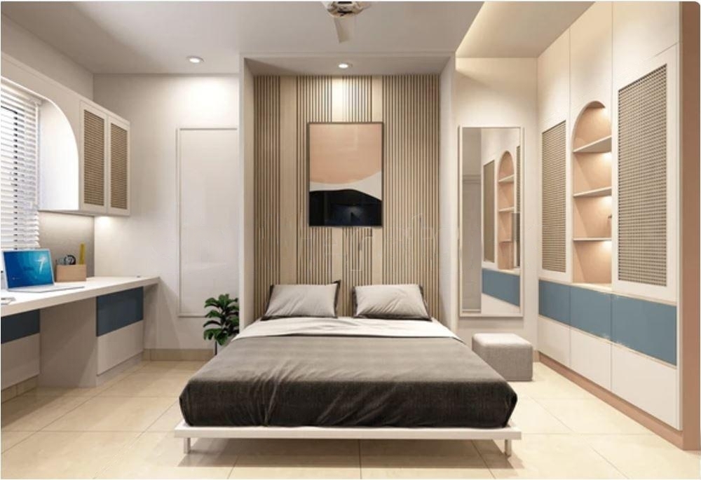 Modern bedroom with a Murphy bed, desk, and storage solutions.